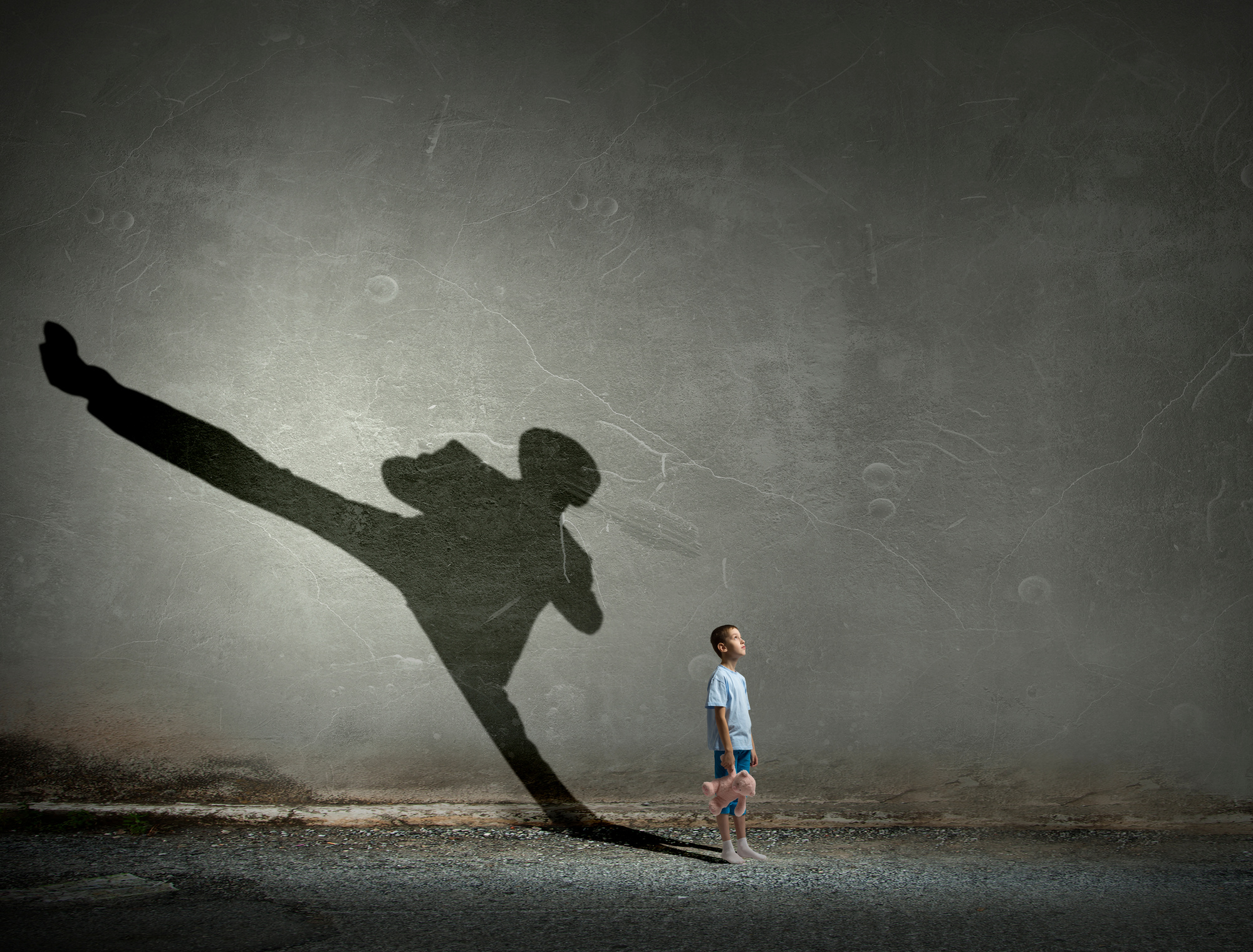 Little Boy and a Shadow of a Karate Player